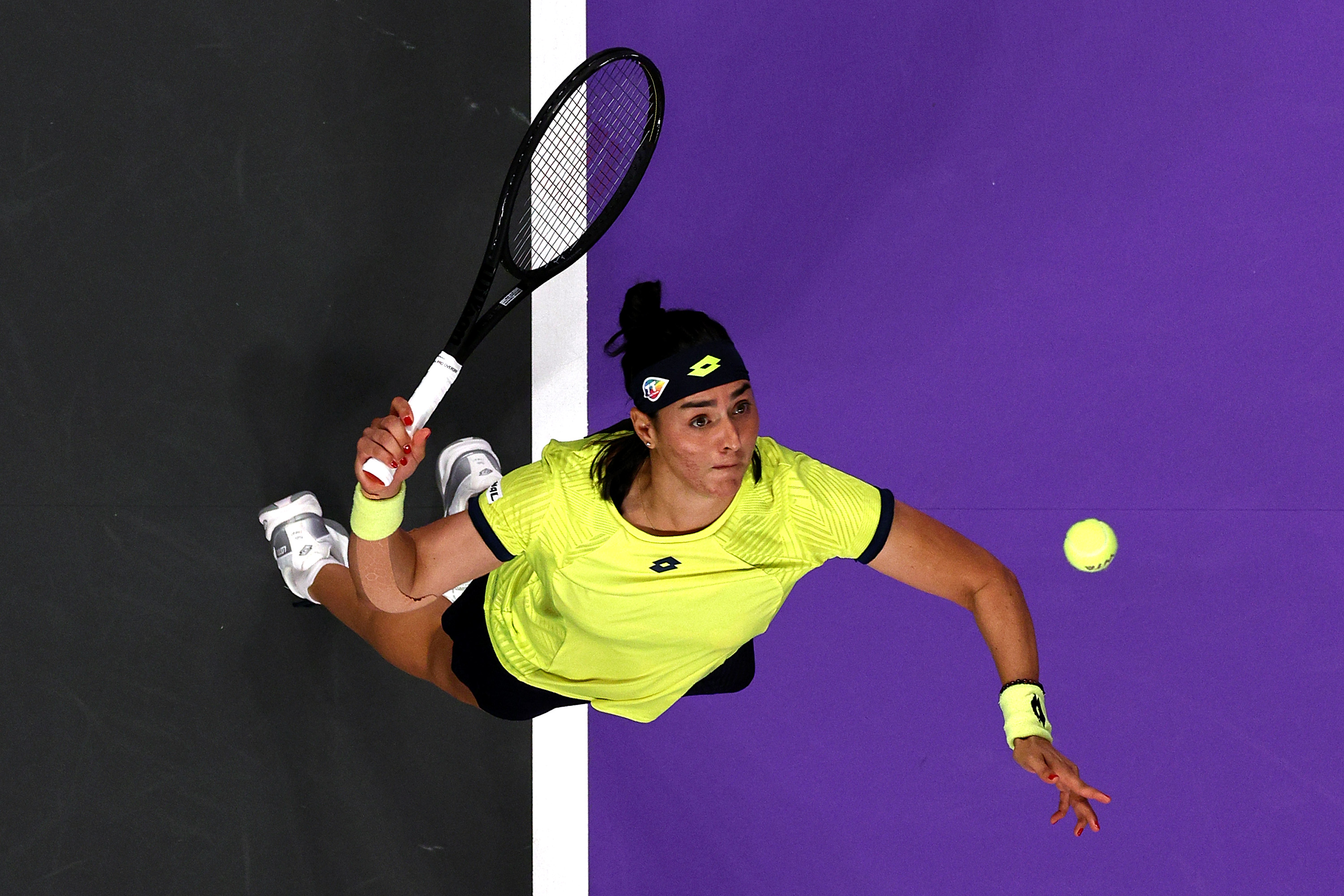 Ons Jabeur serving at the WTA Finals 2022