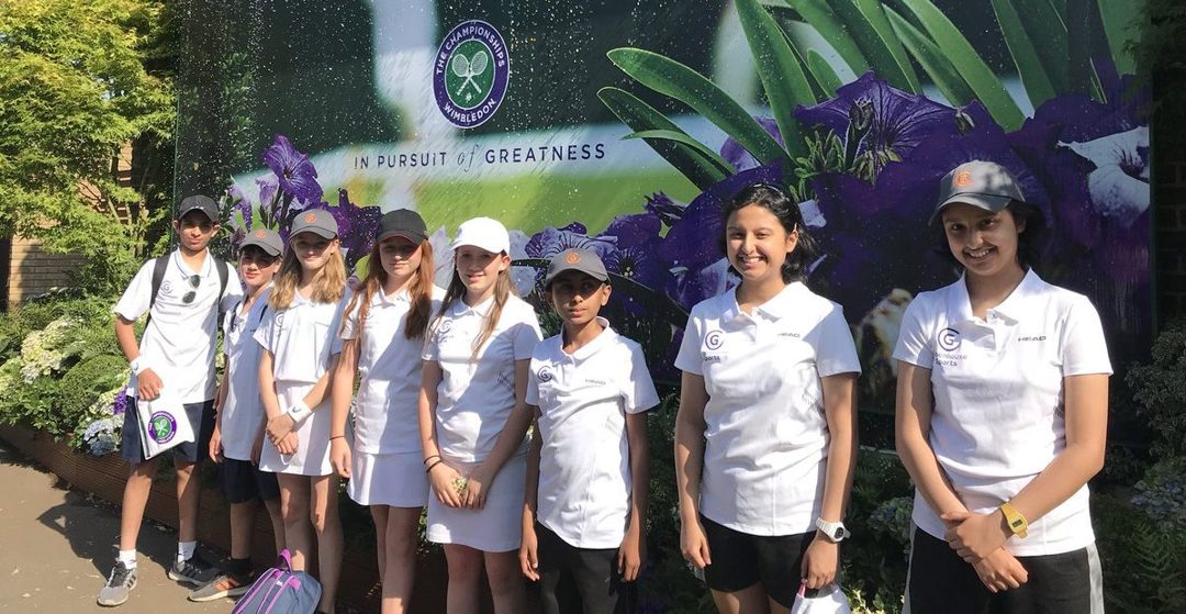 students posing infront of wimbledon